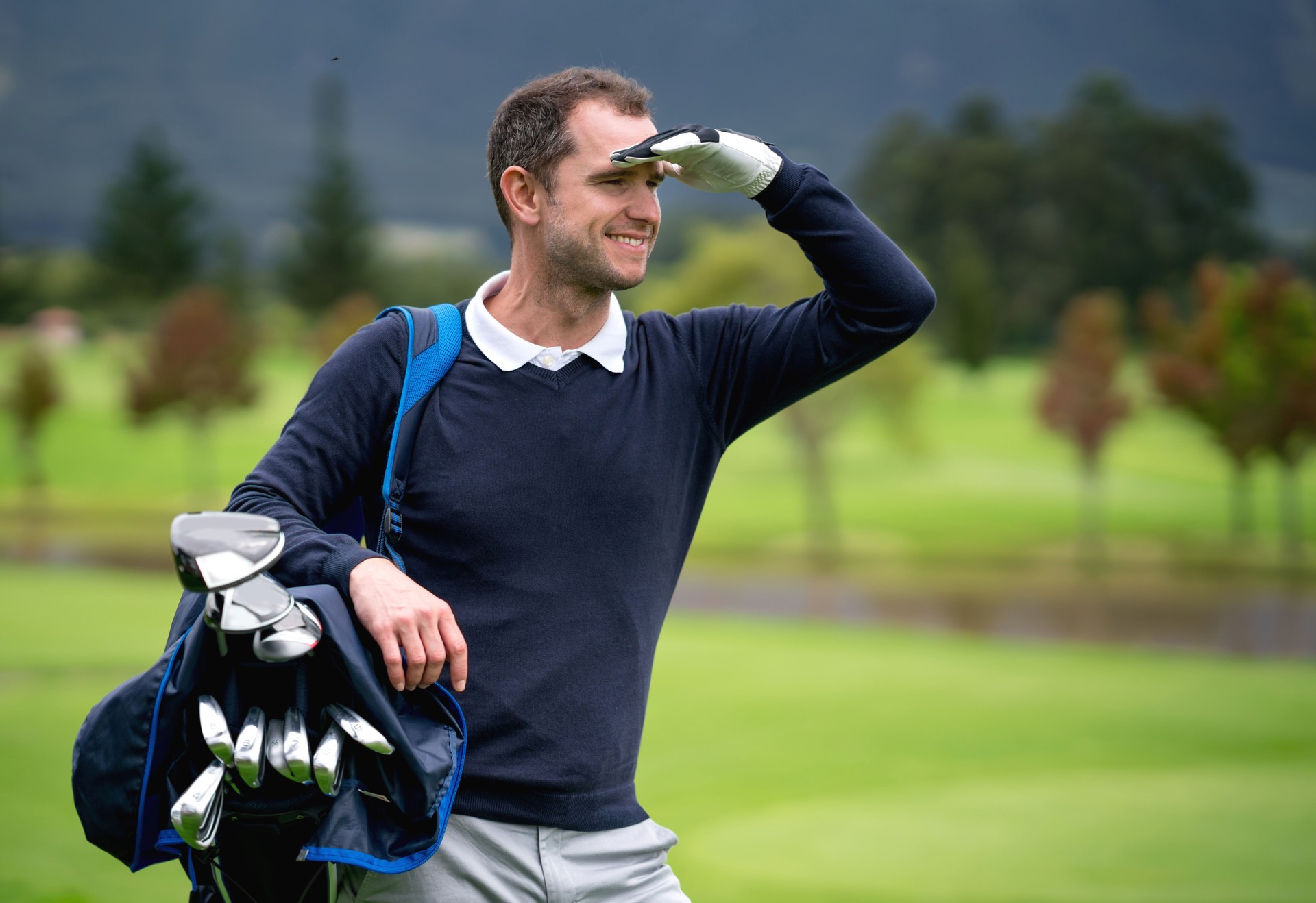 Portrait of a man playing golf and looking away